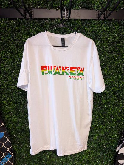 Front of white Puakea Rasta T-shirt with red, yellow, and green Puakea Designs lettering.