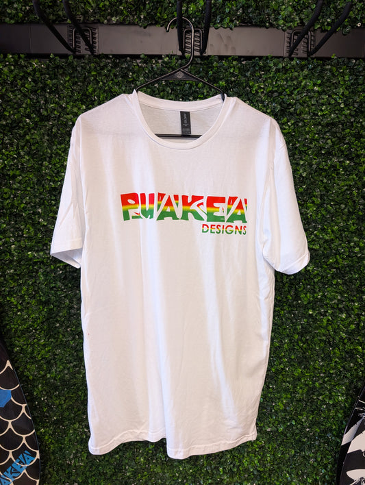 Front of white Puakea Rasta T-shirt with red, yellow, and green Puakea Designs lettering.
